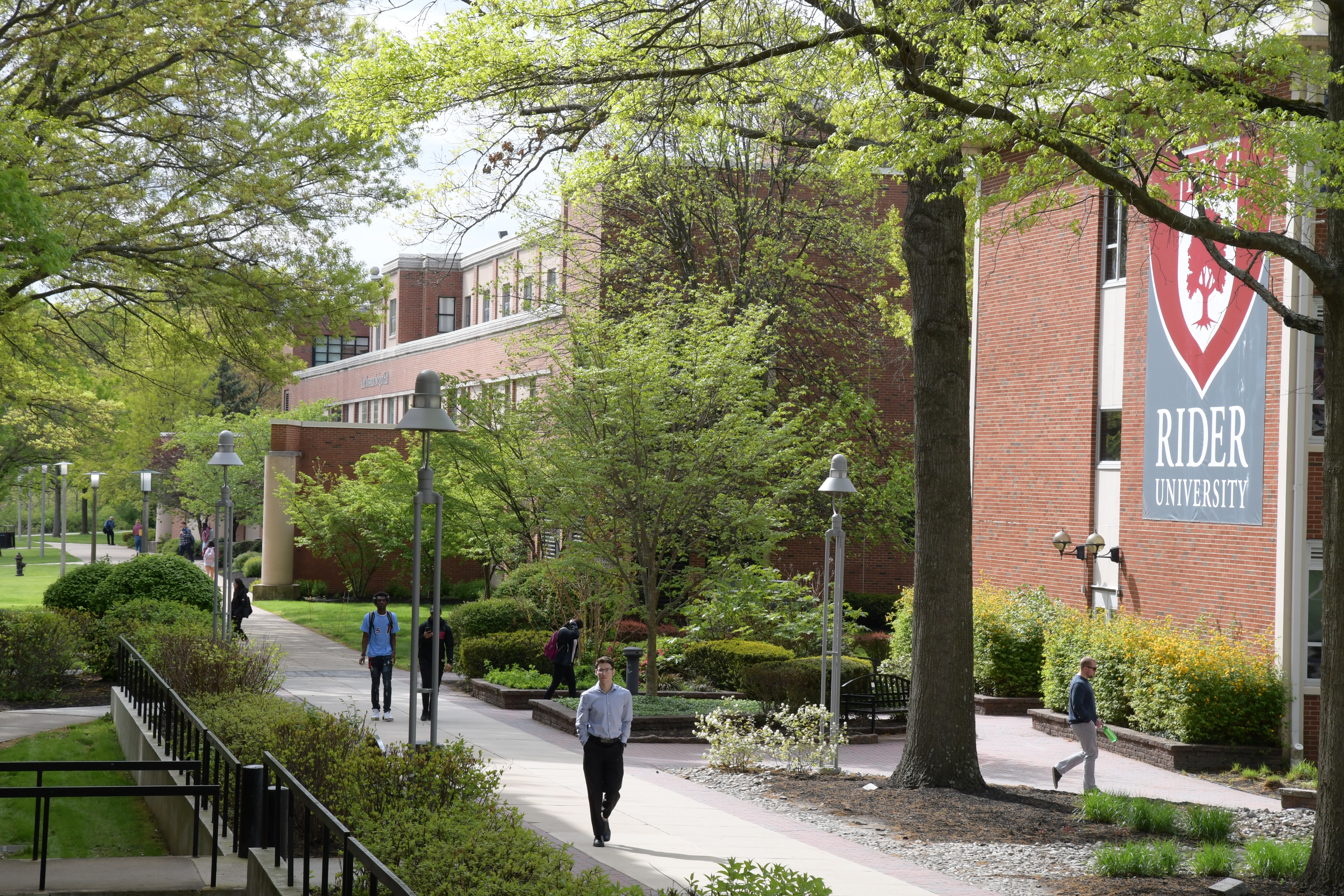 Students walk near academic buildings