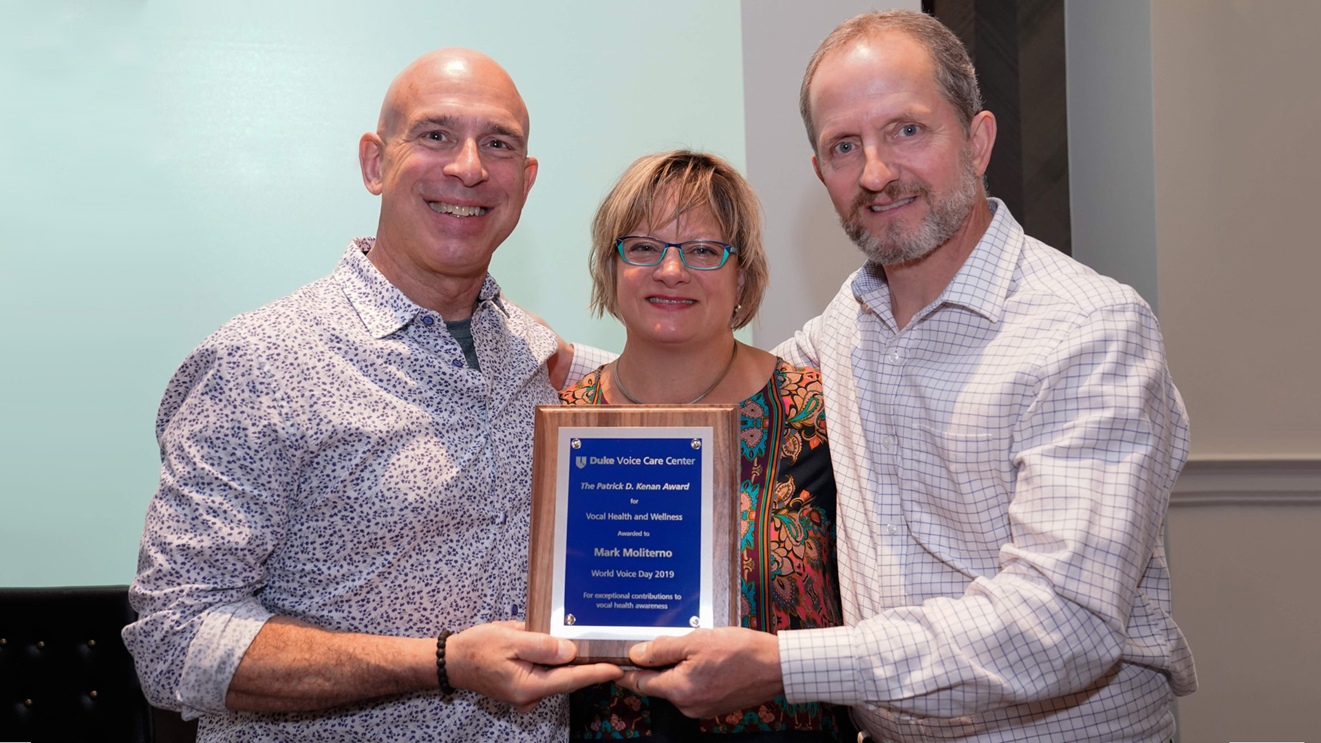 Mark Moliterno with his award