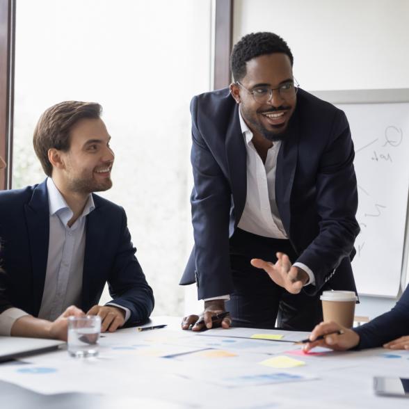 Man makes presentation to eager colleagues