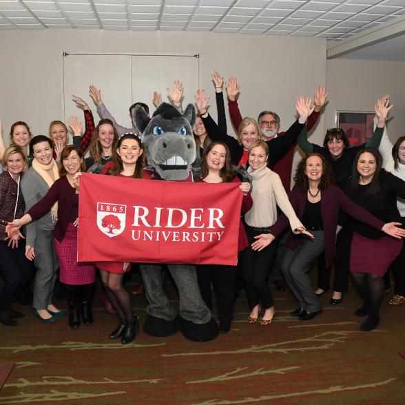 University Advancement poses with AJ the Bronc