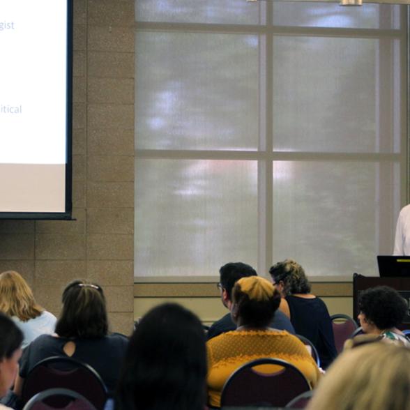 Don Ambrose presents during the symposium