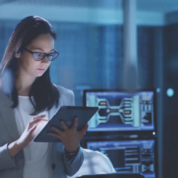 Woman uses tablet in office setting