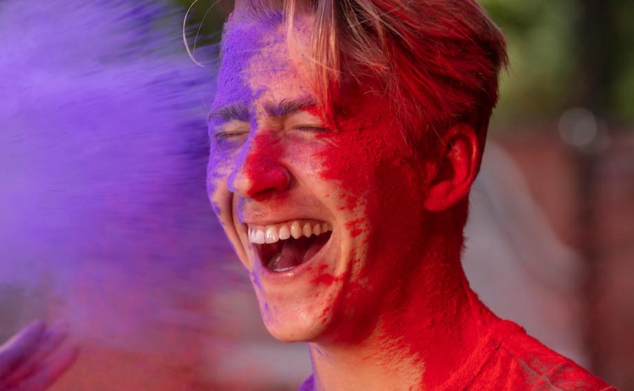 Student get's purple and red paint thrown at him.