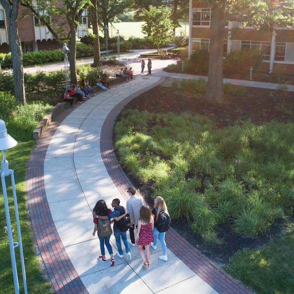 Students walk to class in summer