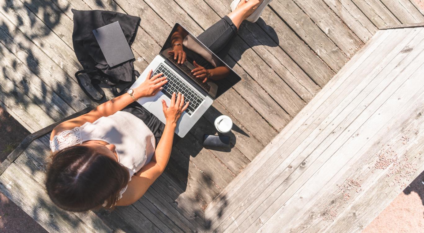 Woman on laptop outside