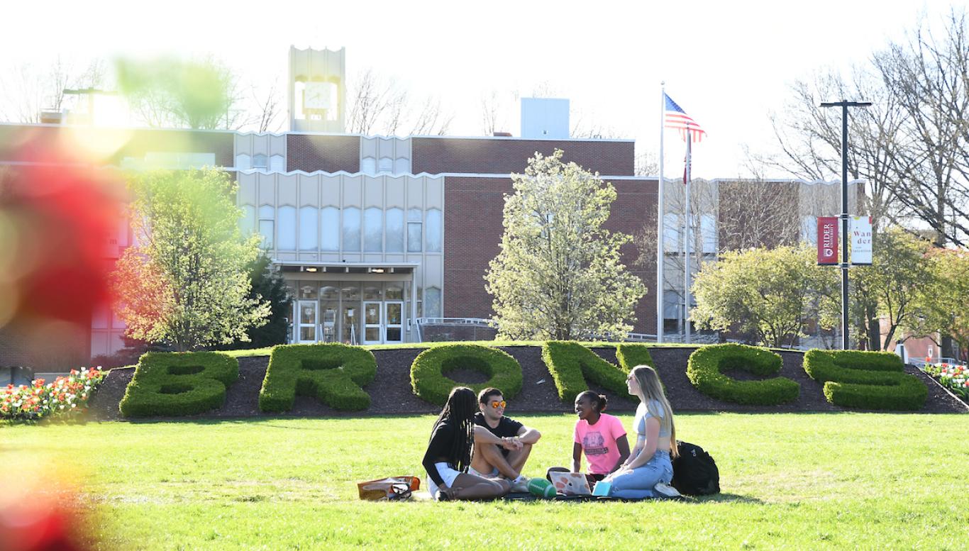 Students sitting on Campus Mall
