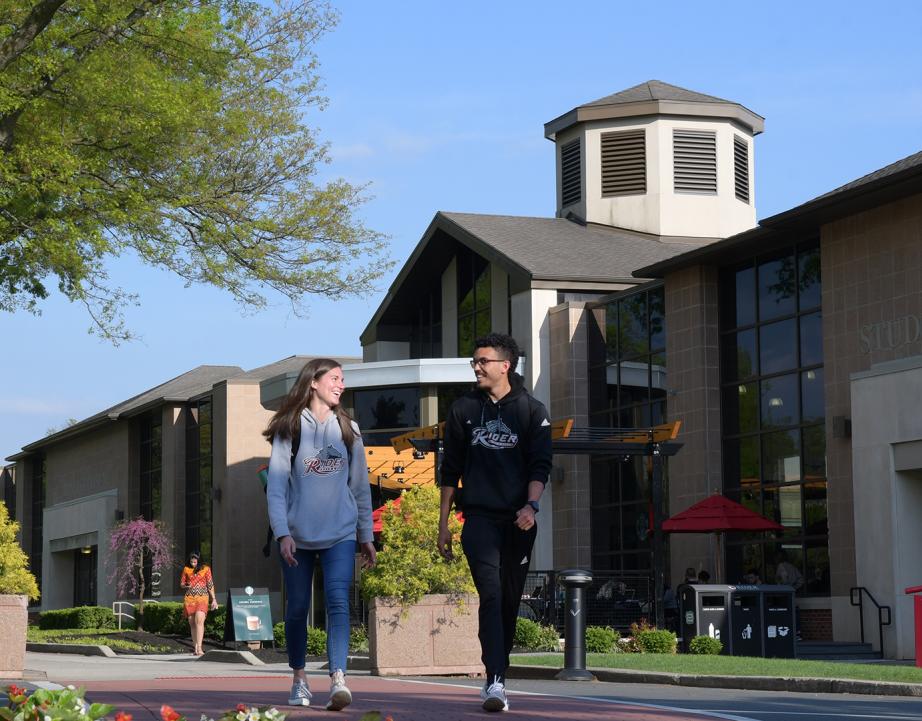 Two students walking on campus