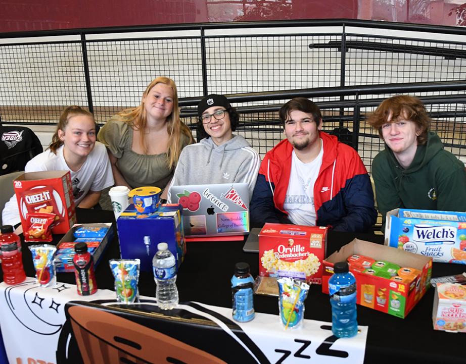 Students selling products at Business in Action Market Fair