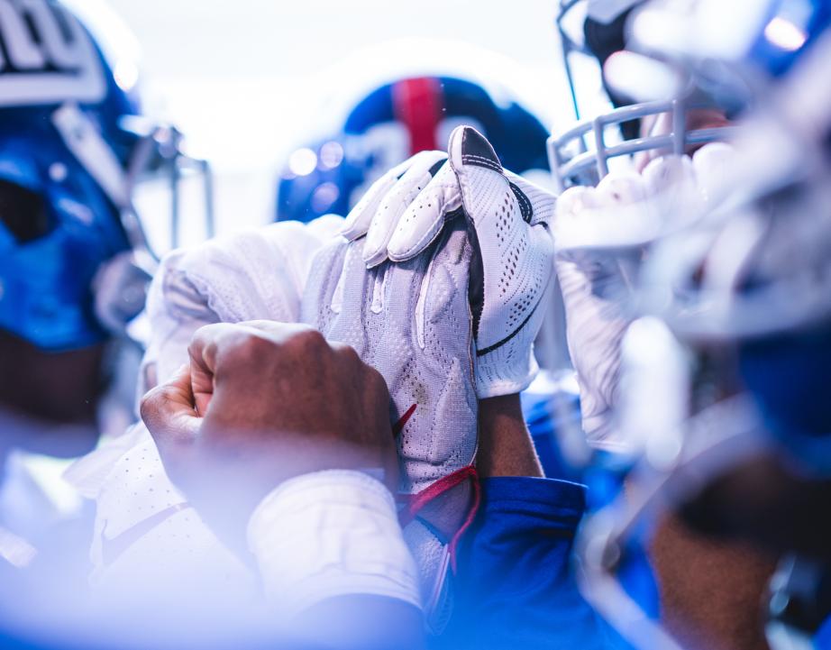 Close up photograph of New York Giants shaking hands