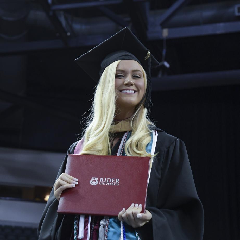 Student in cap and gown at 2019 commencement